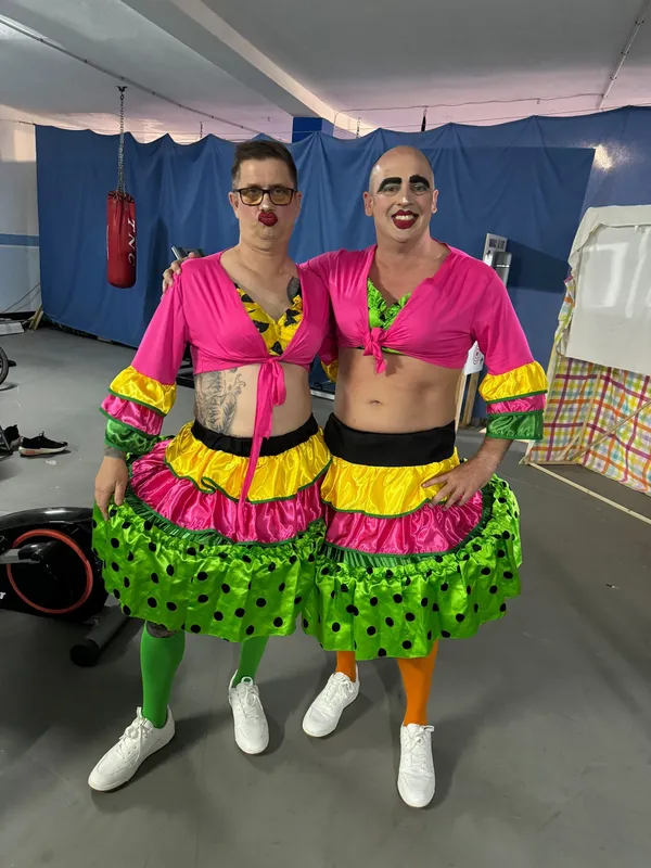 Pete and Dave in matching pantomime costumes on stage in Lanzarote